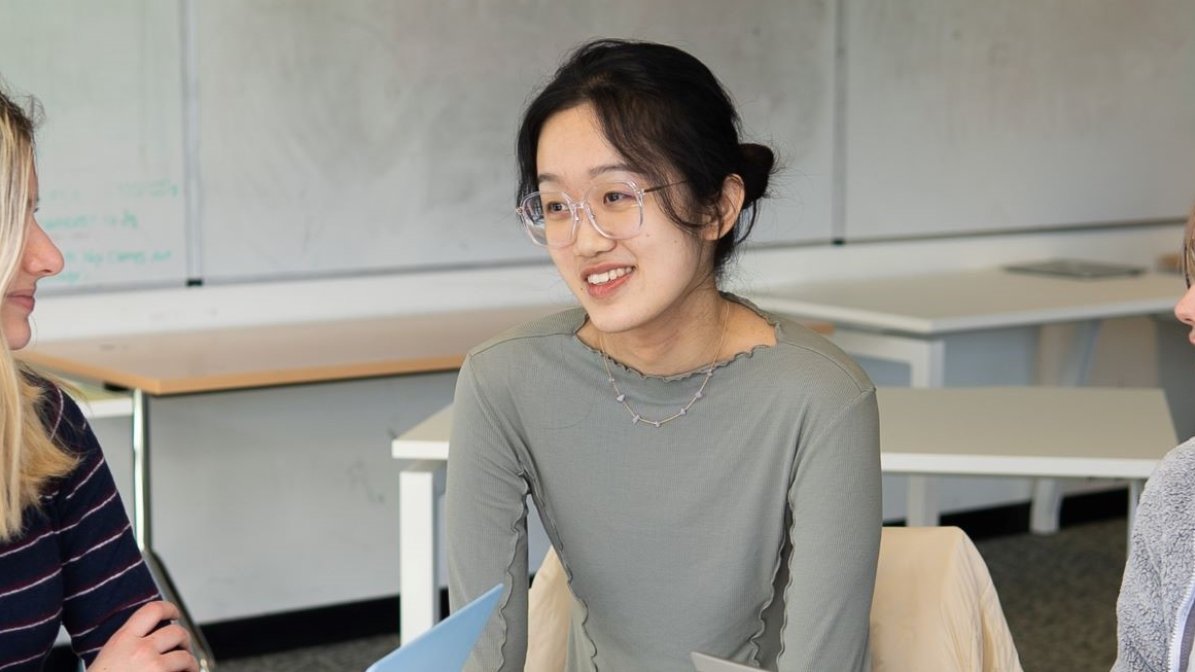 Students working on laptops together