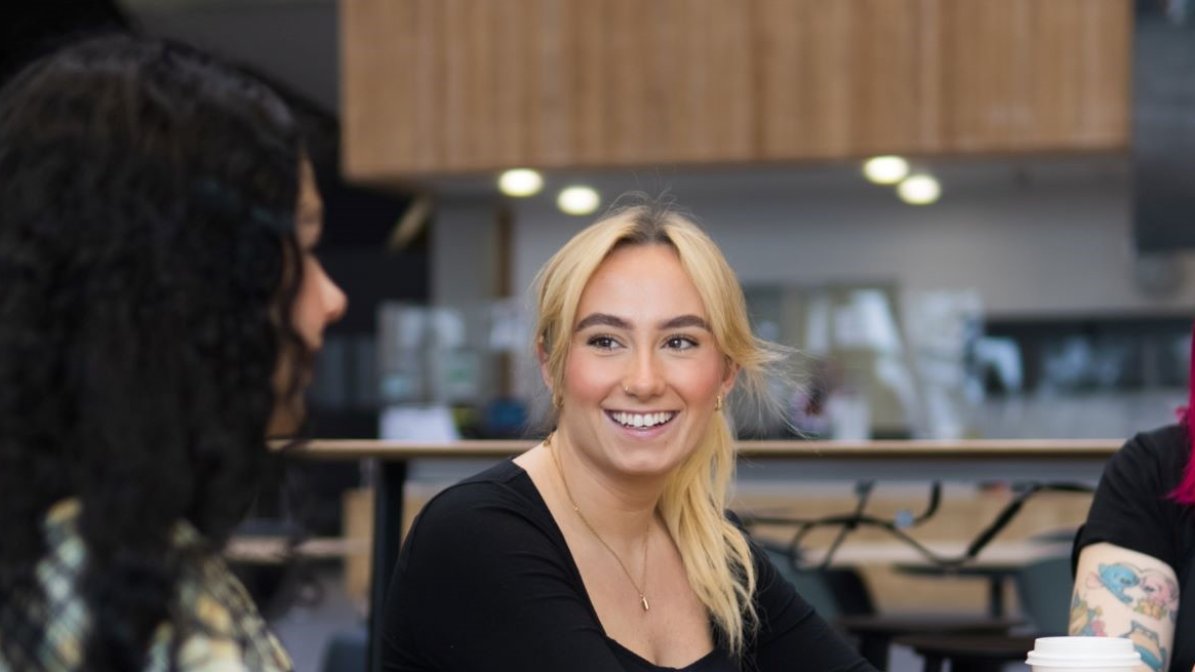 Students chatting in communal area at university