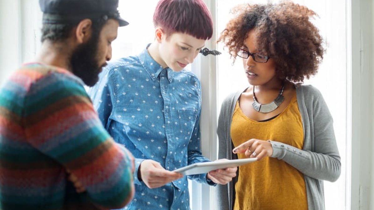 Students looking at tablet
