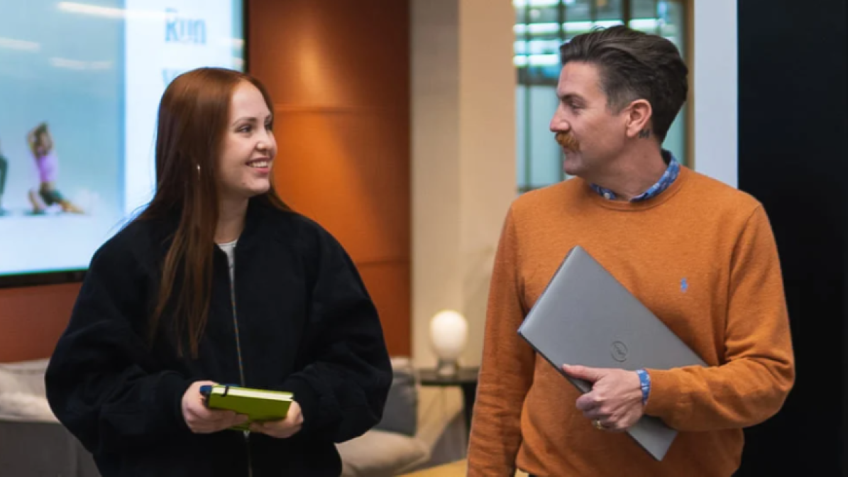 Apprentices chatting and walking in workplace