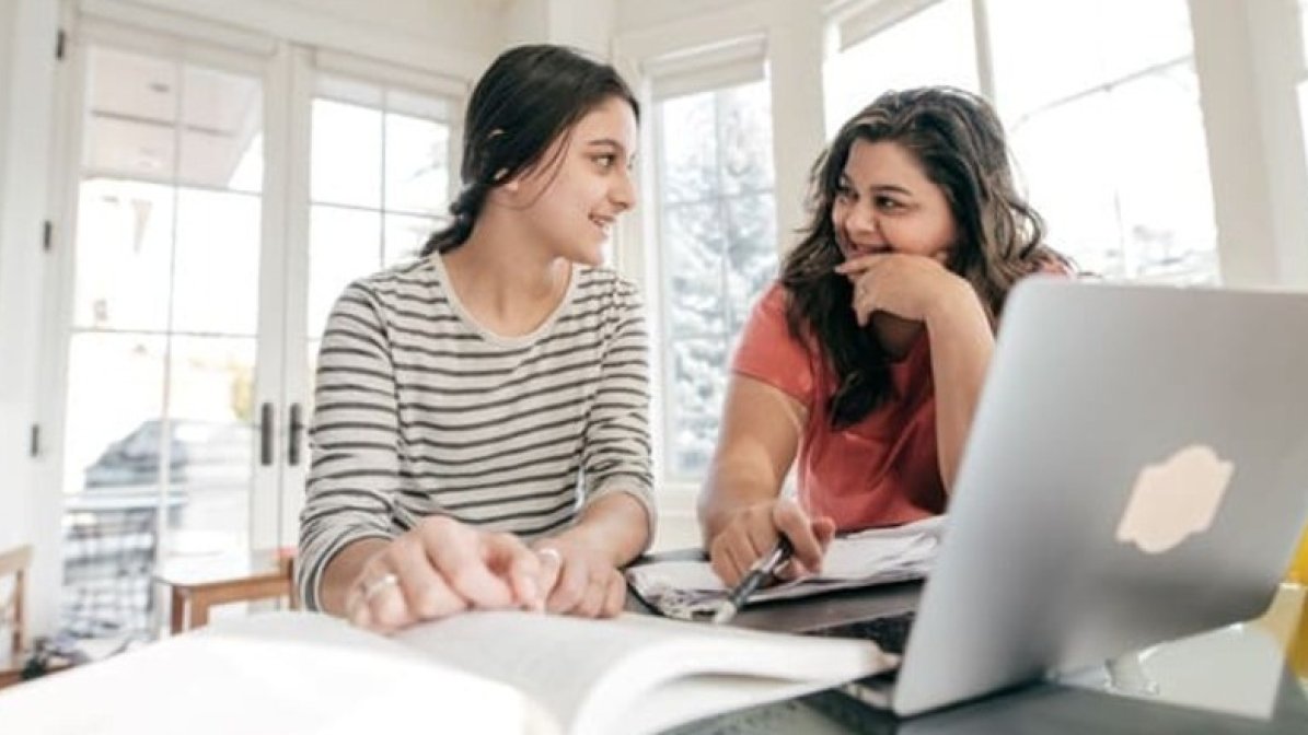 Parent and child researching options online 