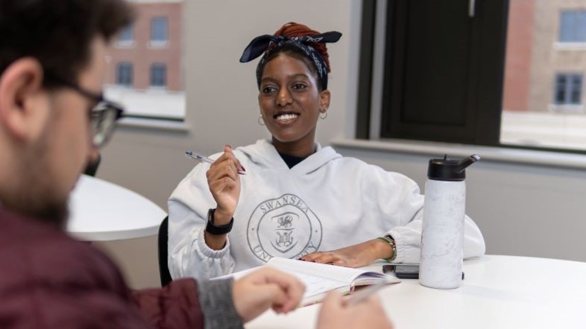 Students talking in a classroom 