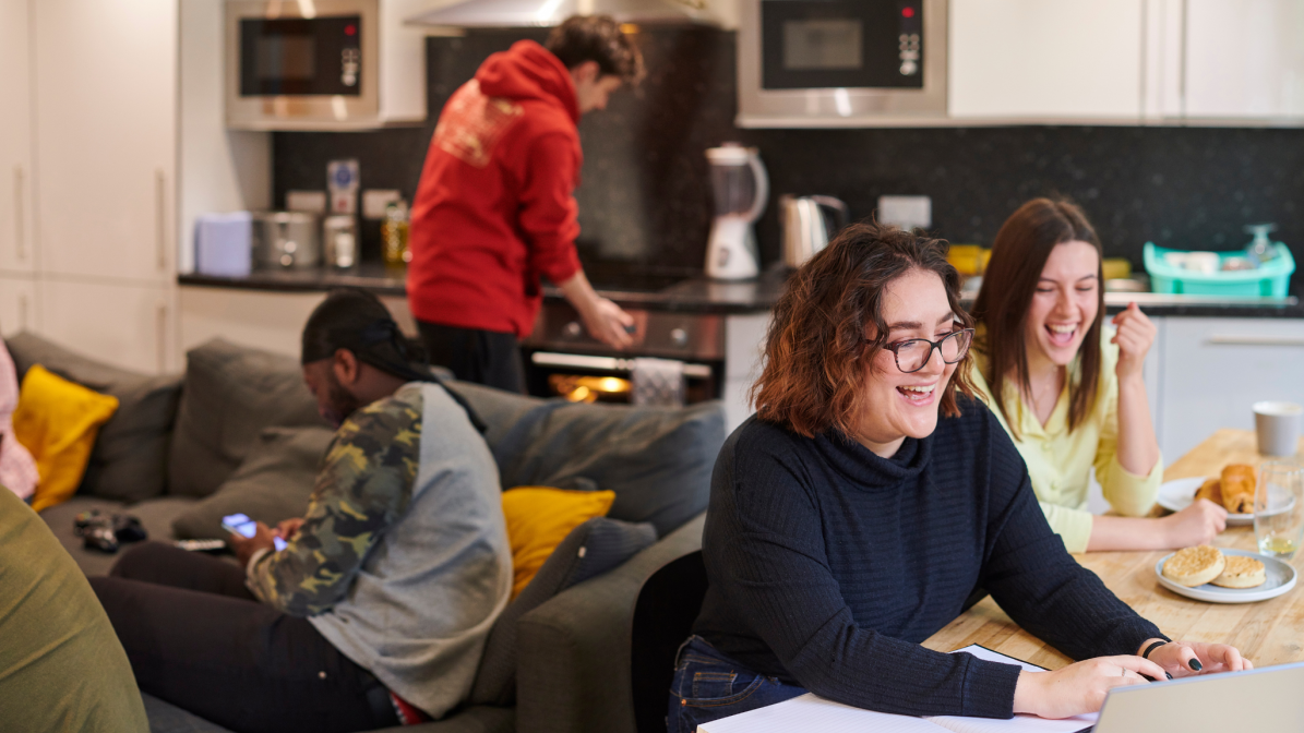 A group of students sat talking in student accommodation