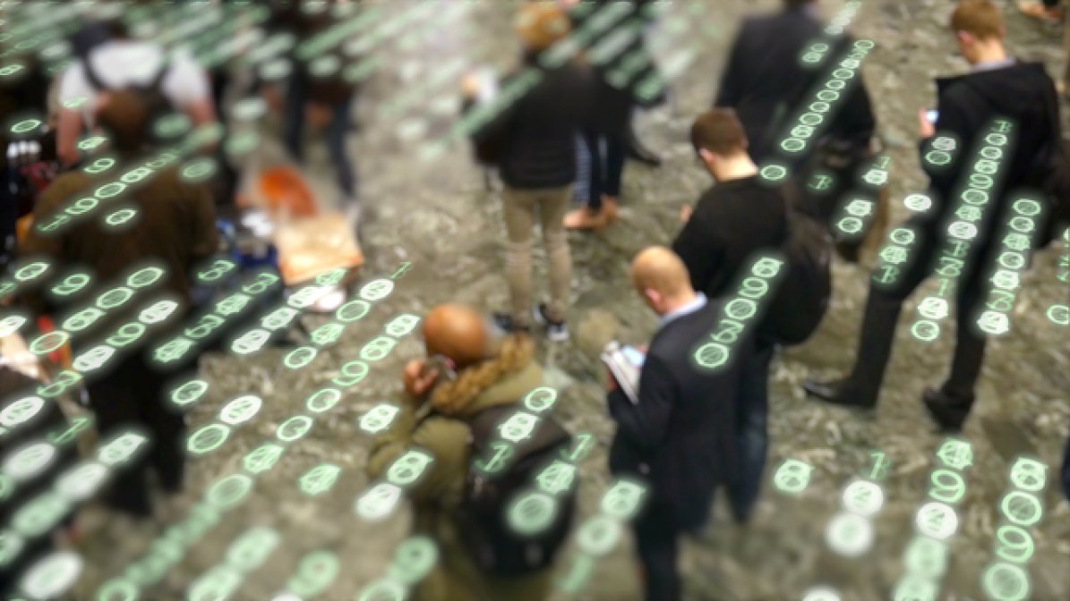 People using mobile devices with digital coding superimposed on image 