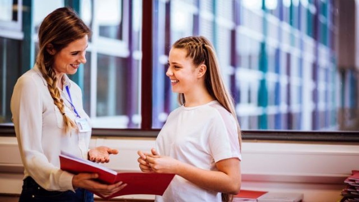 Adviser talking to a student