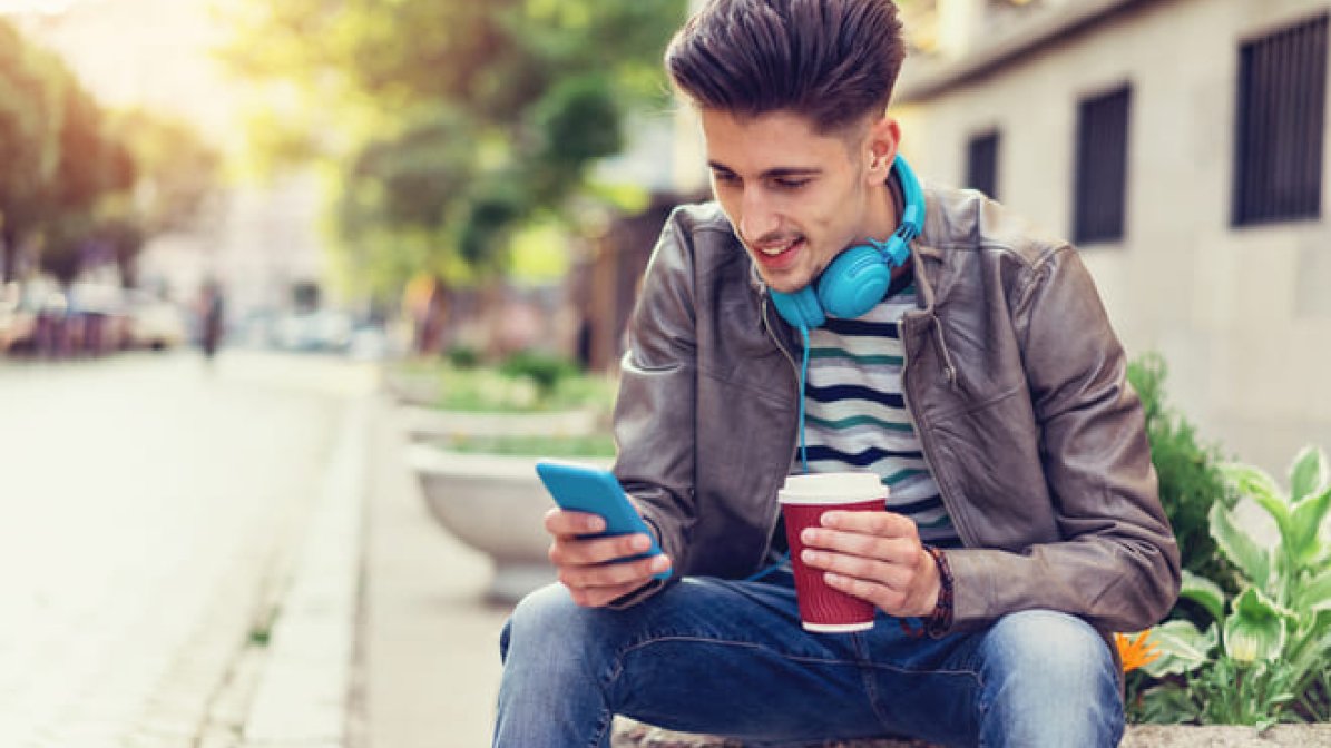 Student checking mobile phone