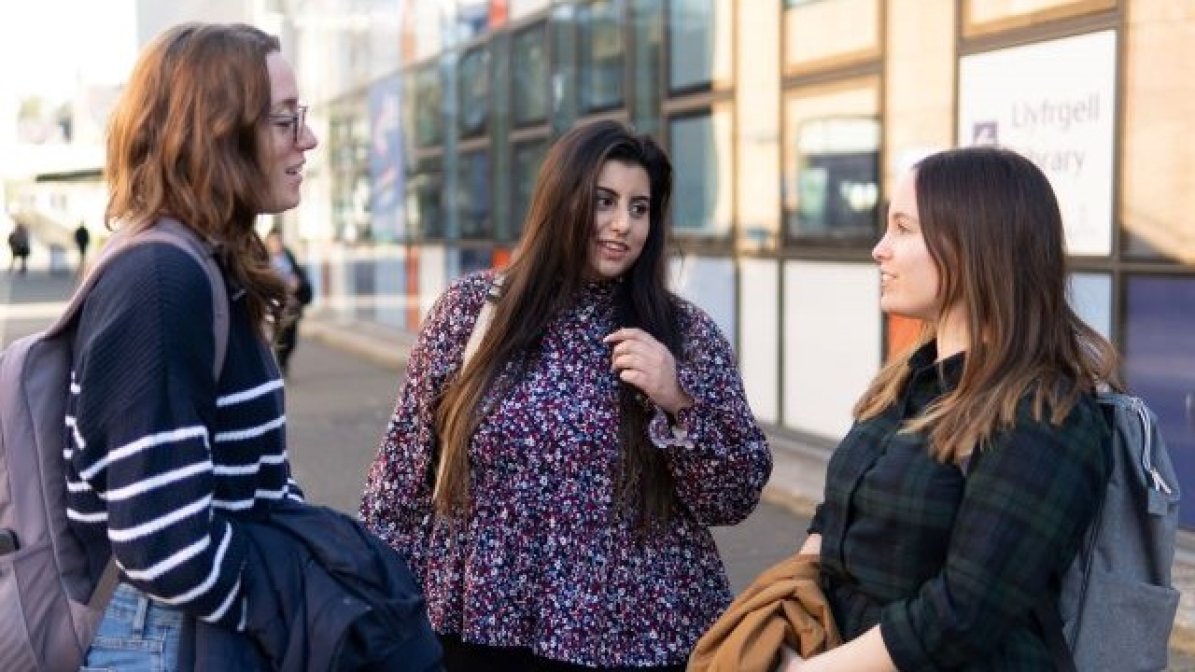 Students chatting on university campus