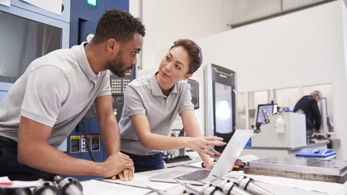 Robotics engineers in workplace 