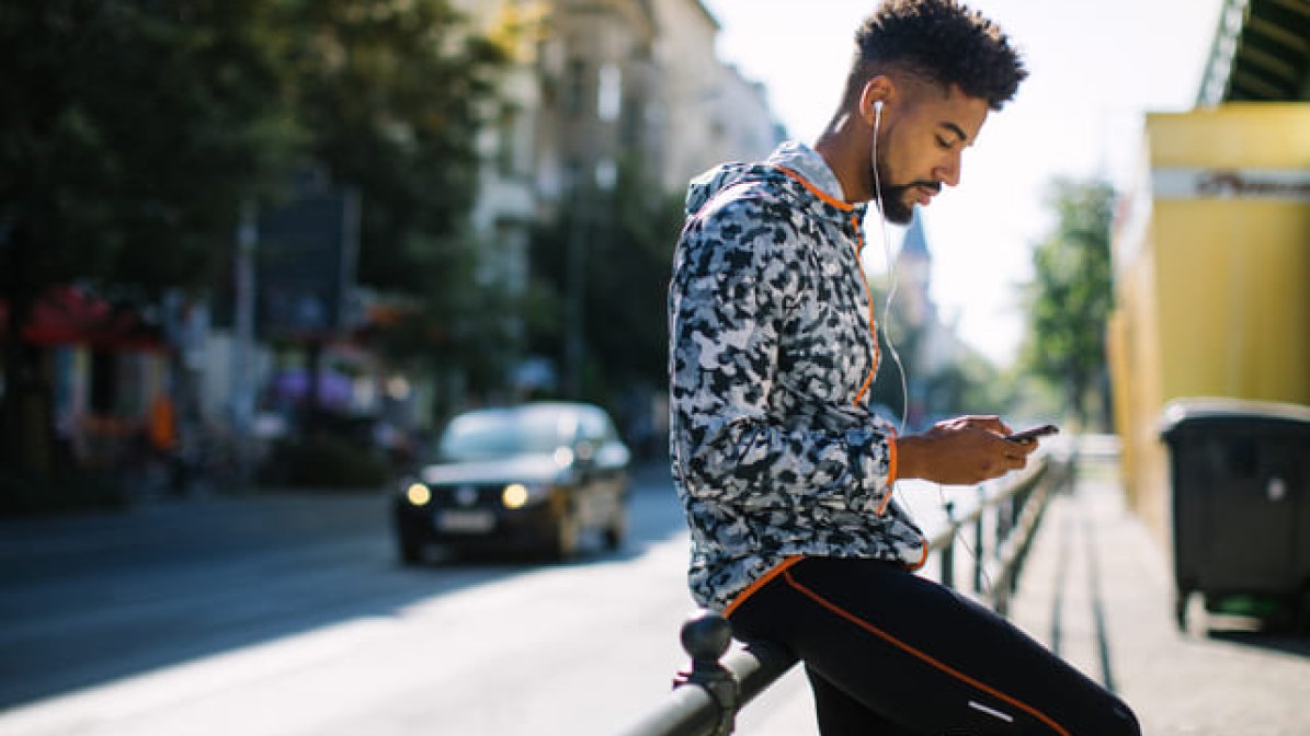 Student browsing employers on mobile phone 