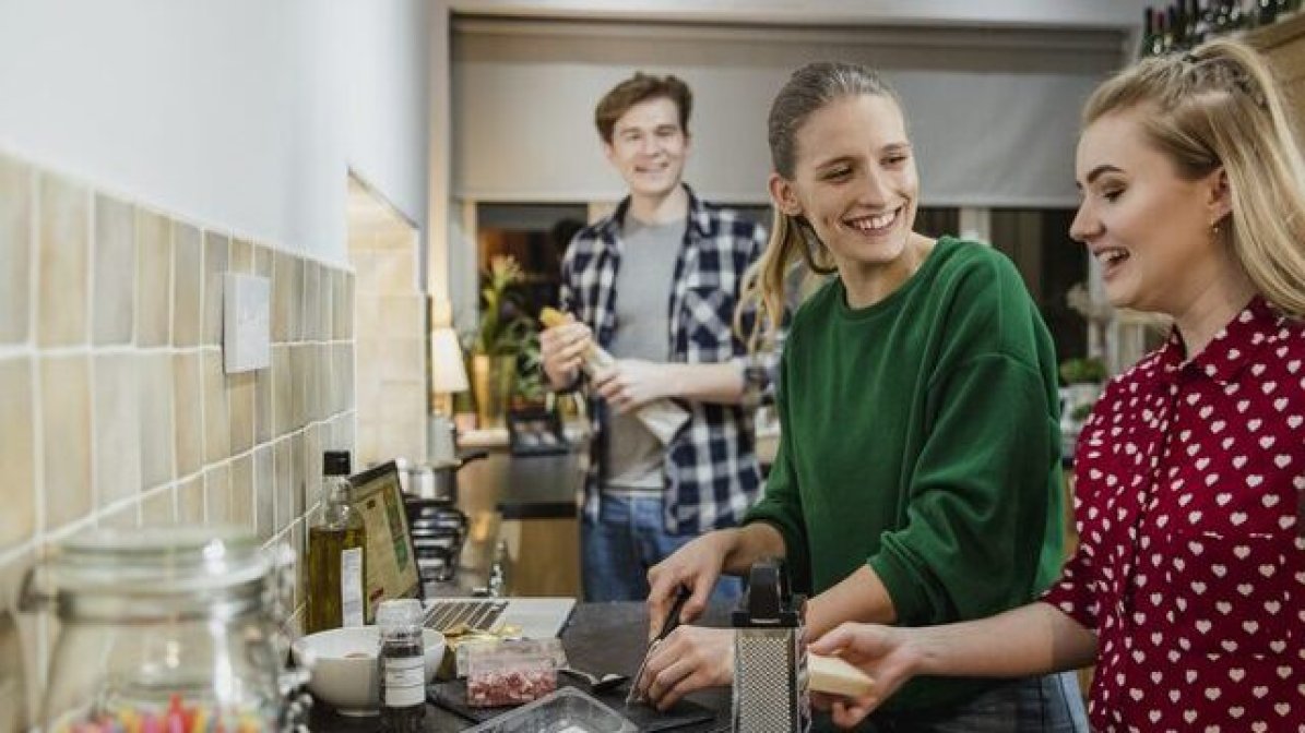 Students chatting in kitchen