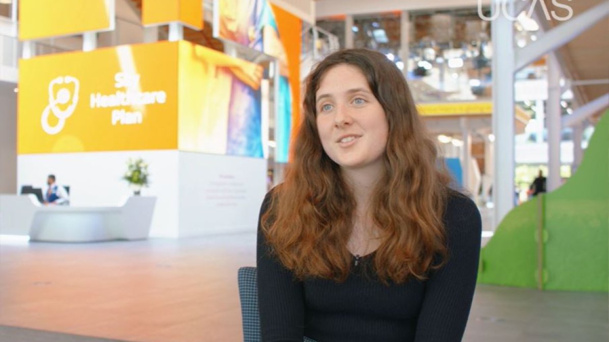 Samantha Connolly, a Technical Marketing Apprentice at Sky, is photographed sat in a lobby area of the Sky head office. 