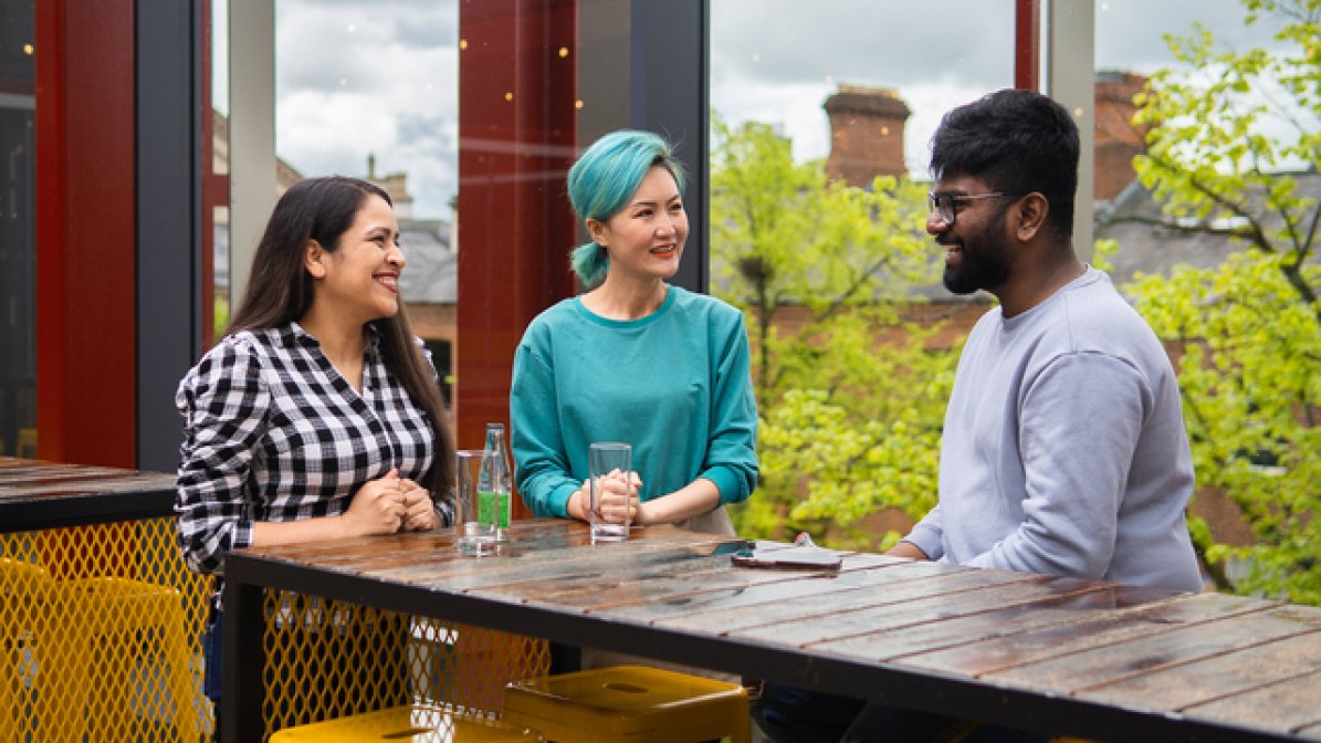 Students chatting in communal area at university
