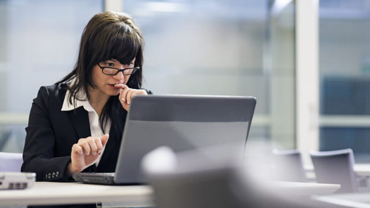 Legal employee working working on laptop 