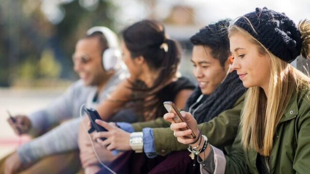 Students checking mobile phones
