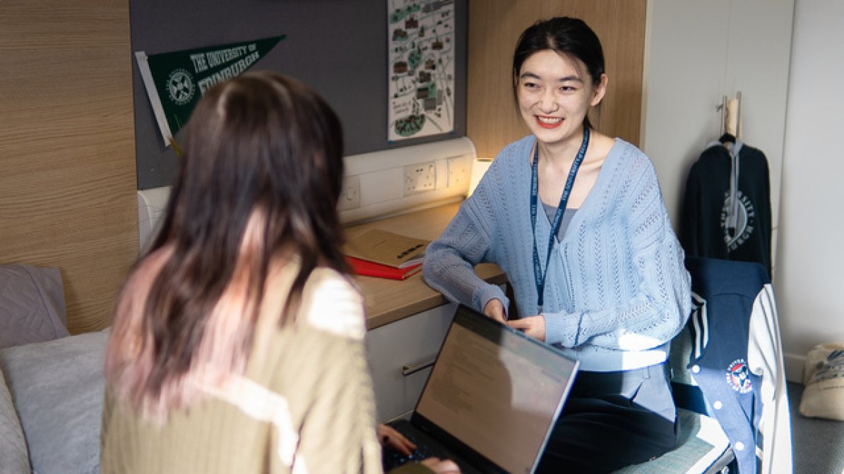Students chatting in halls bedroom 