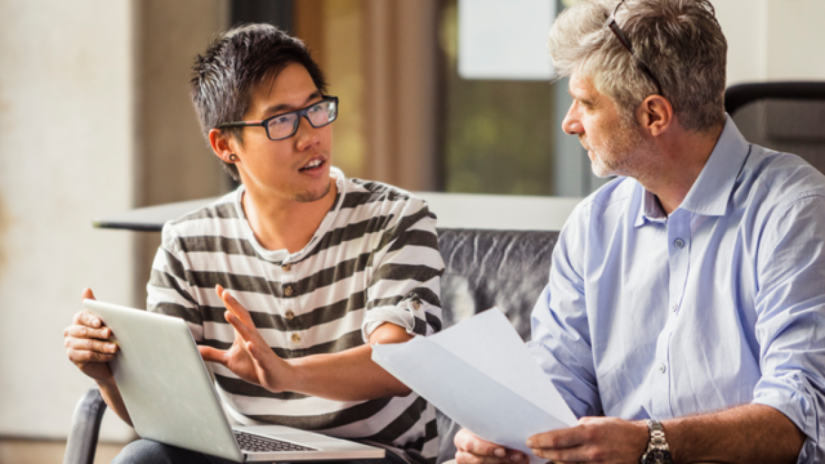 Parent and child chatting on sofa 