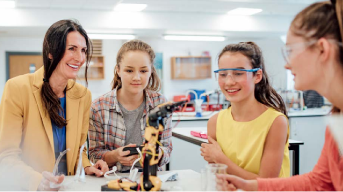 Teacher and pupils in science lab