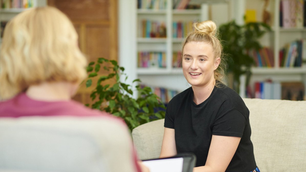 Provider chatting to WP student