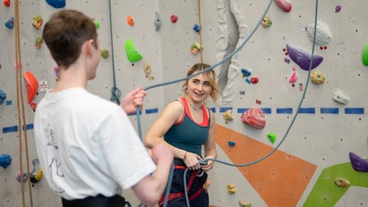 Students using a climbing wall