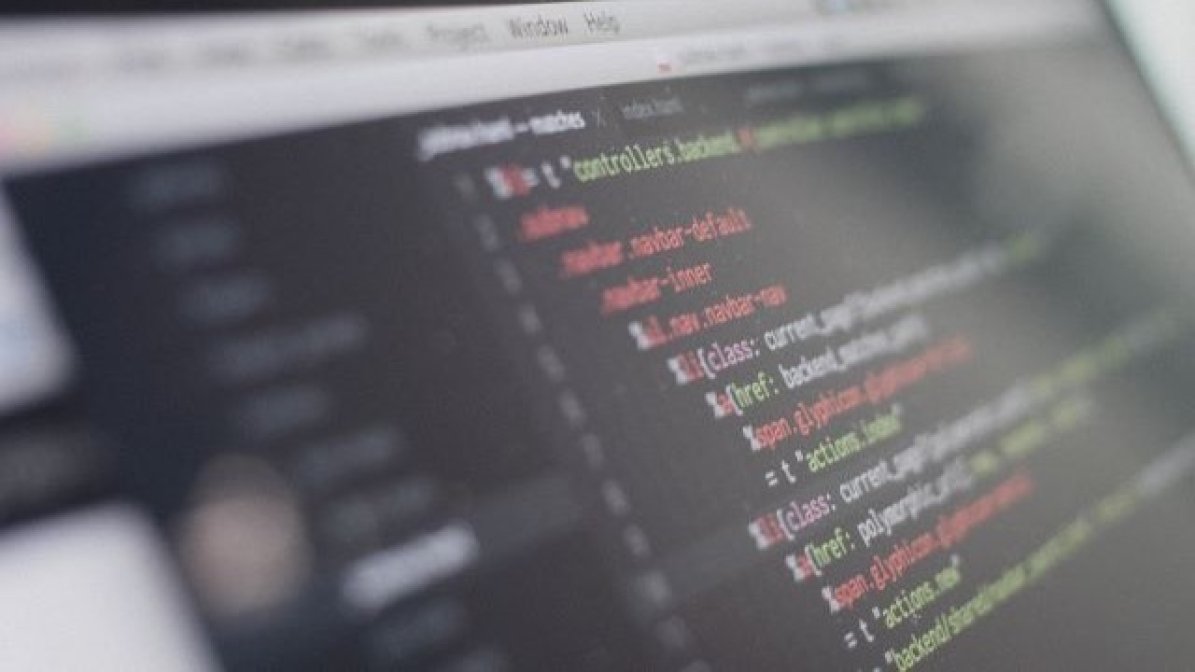 Laptop showing coding on screen 