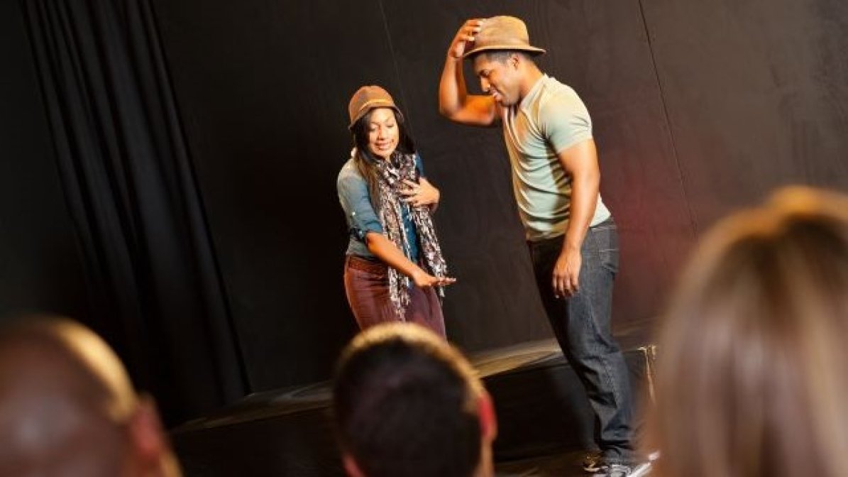 Actors in front of an audience