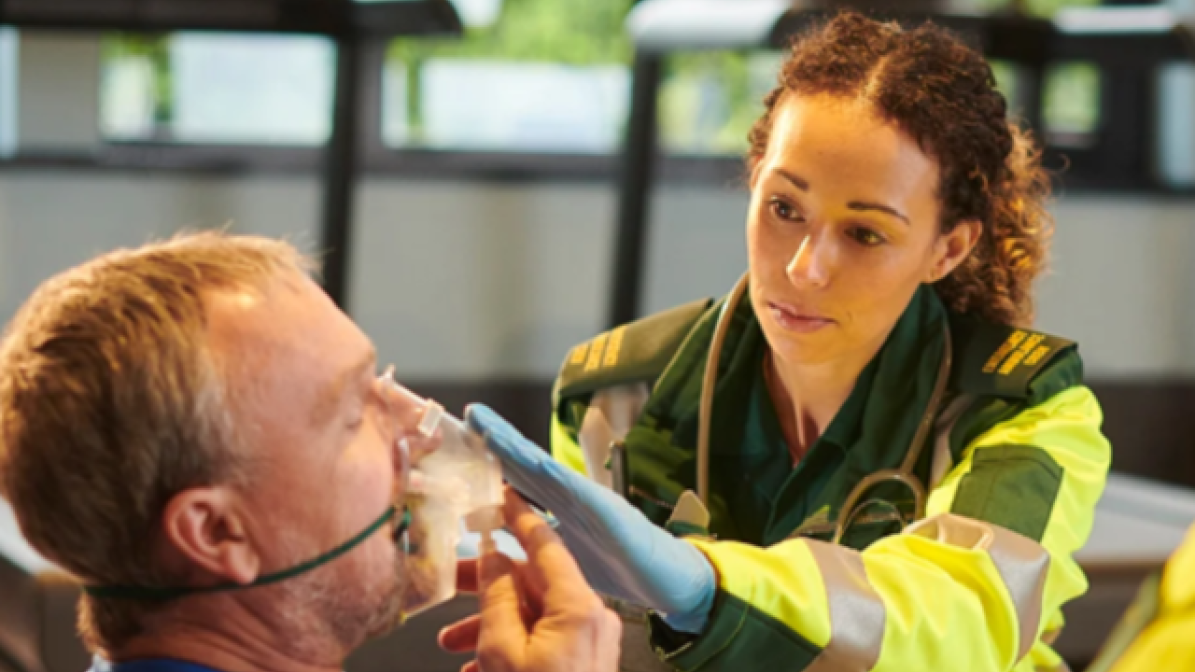 A paramedic treating a patient