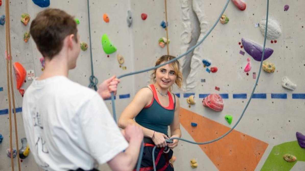 Students using a climbing wall