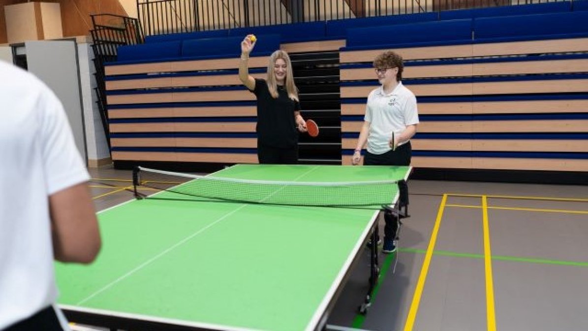 Students playing table tennis