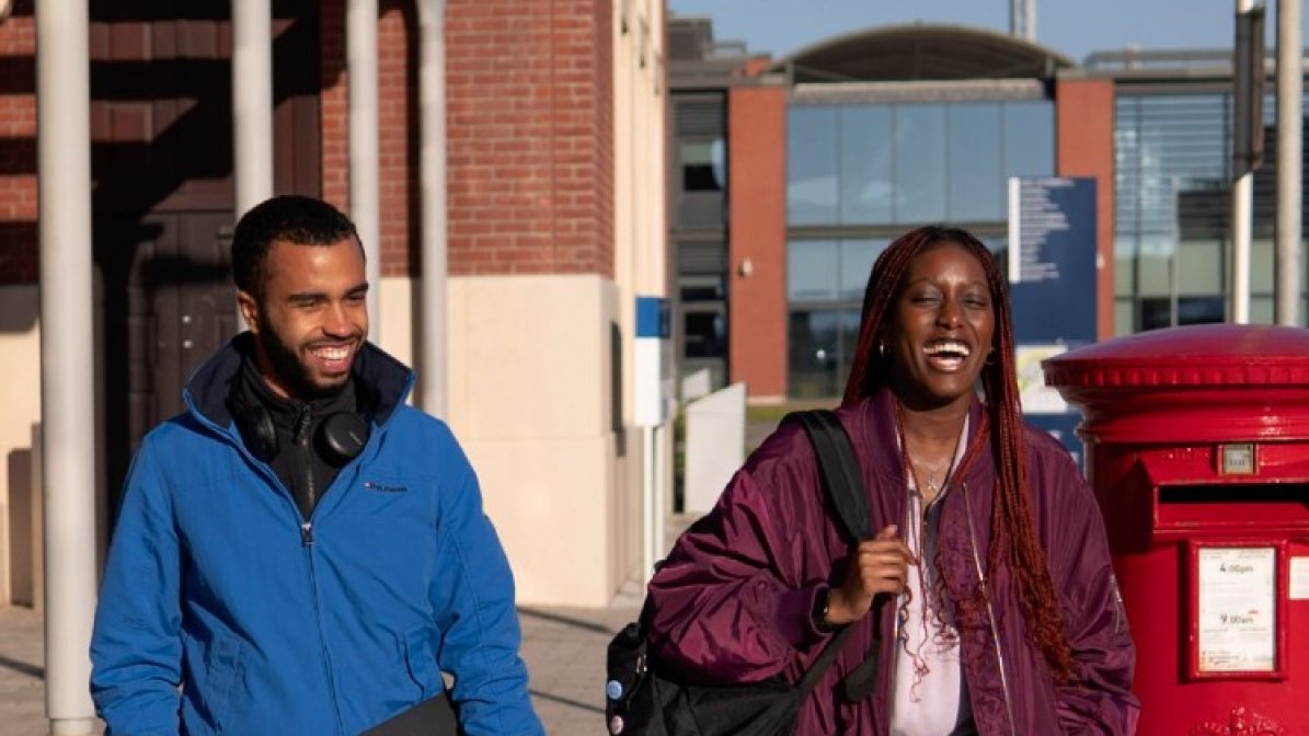 Two students walking down the street