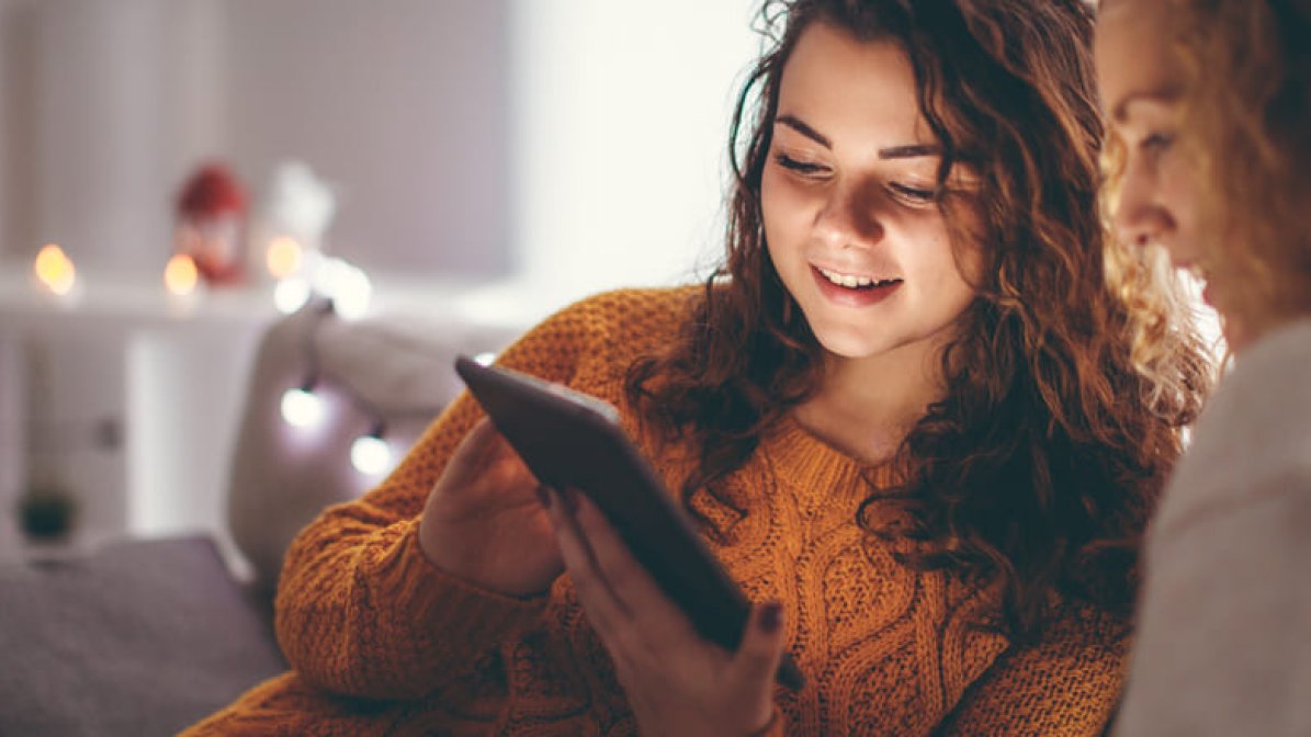 Student and parent looking at tablet