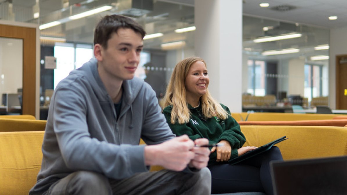 Students siting in communal area at university