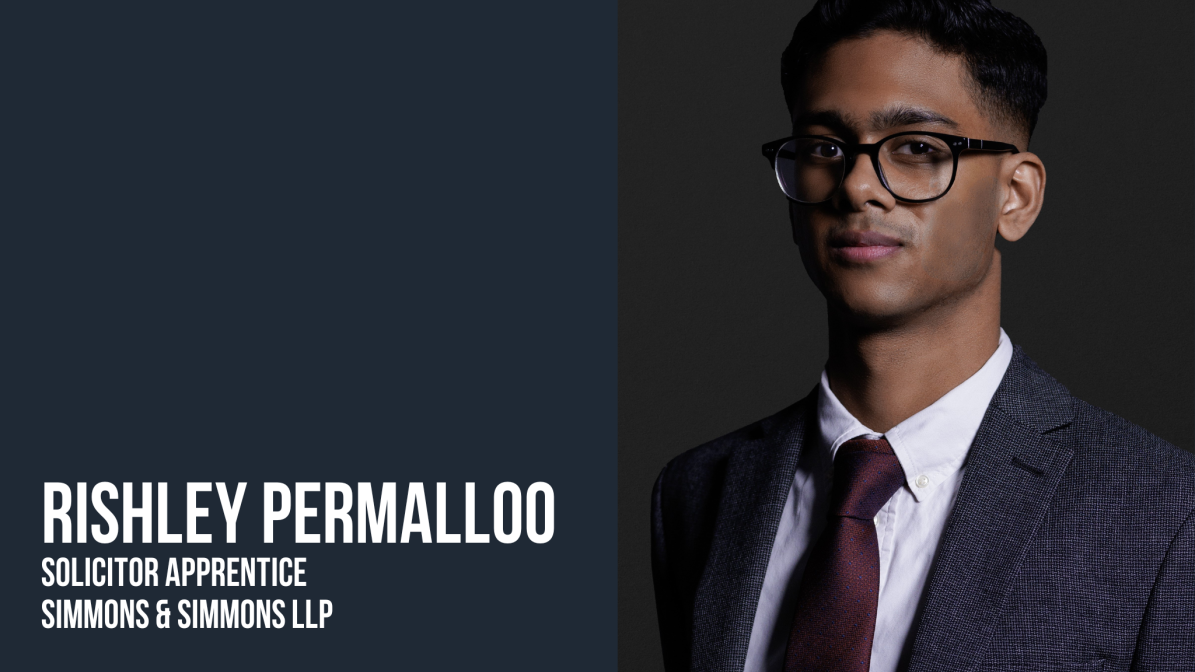 Headshot of Rishley Permalloo. Permalloo is wearing glasses, a dark grey suit, white shirt, and red tie. The image shows a professional headshot of him looking to the camera, with his name and job title displayed on a dark grey background to the left.