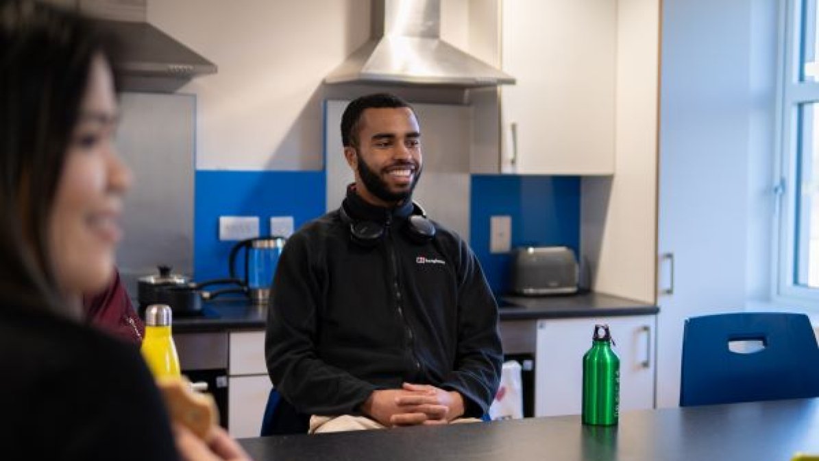 International students in shared house kitchen