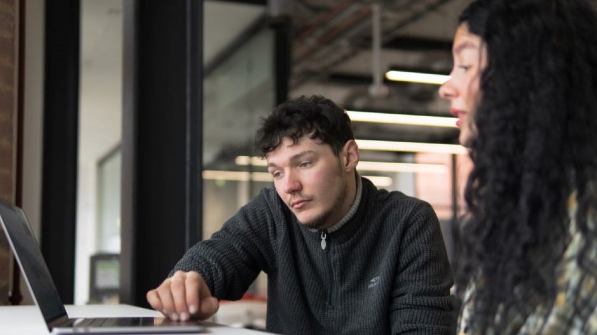 Students making a UCAS application on a laptop  