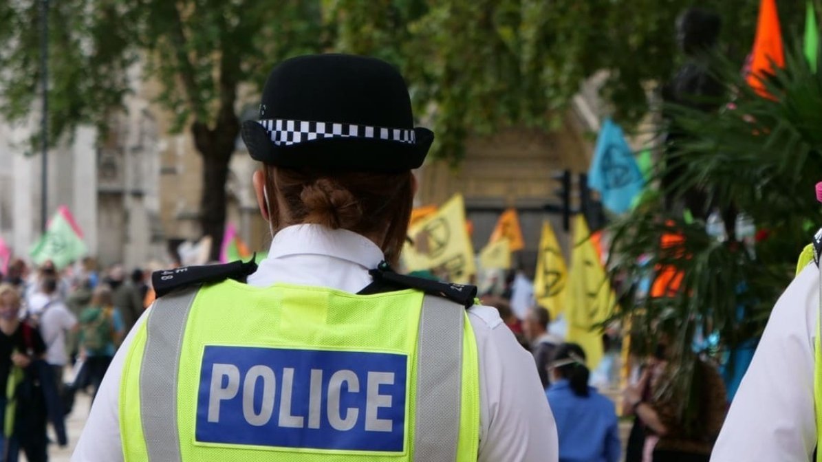 Back view of police officer at an event