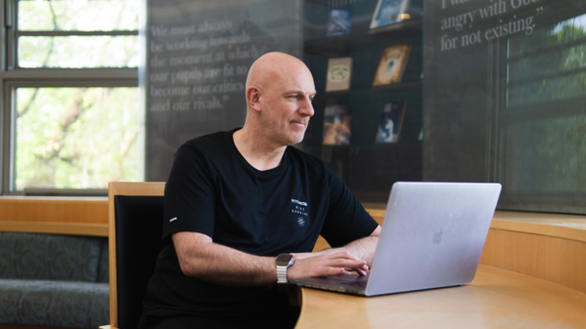 Adviser using laptop