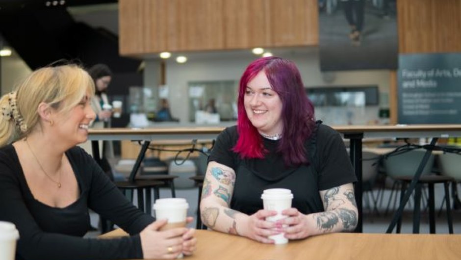 Students chatting in communal area at university