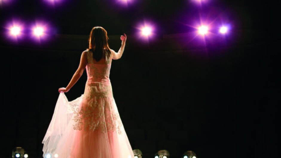 Actor on stage in spotlight