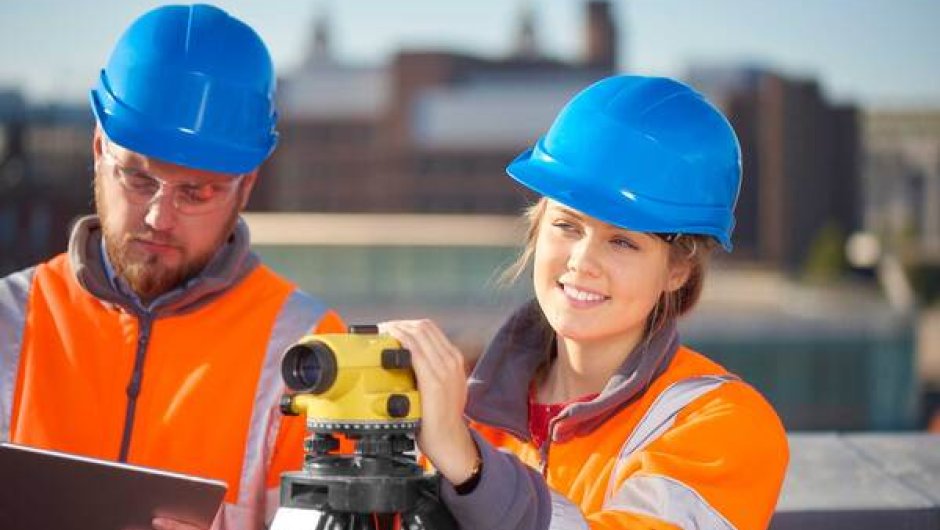 Civil engineering apprentice at work with supervisor