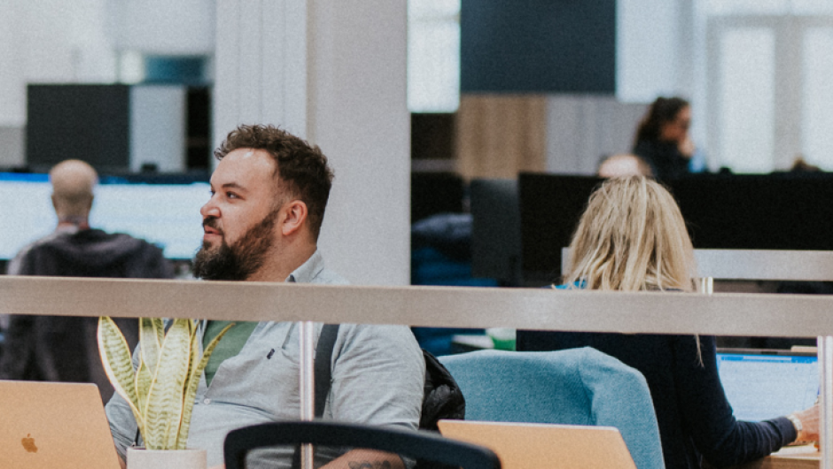 UCAS staff having a conversation in the Rosehill office, Cheltenham