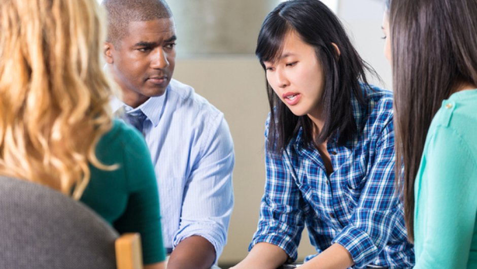 Trainee counsellors in a discussion