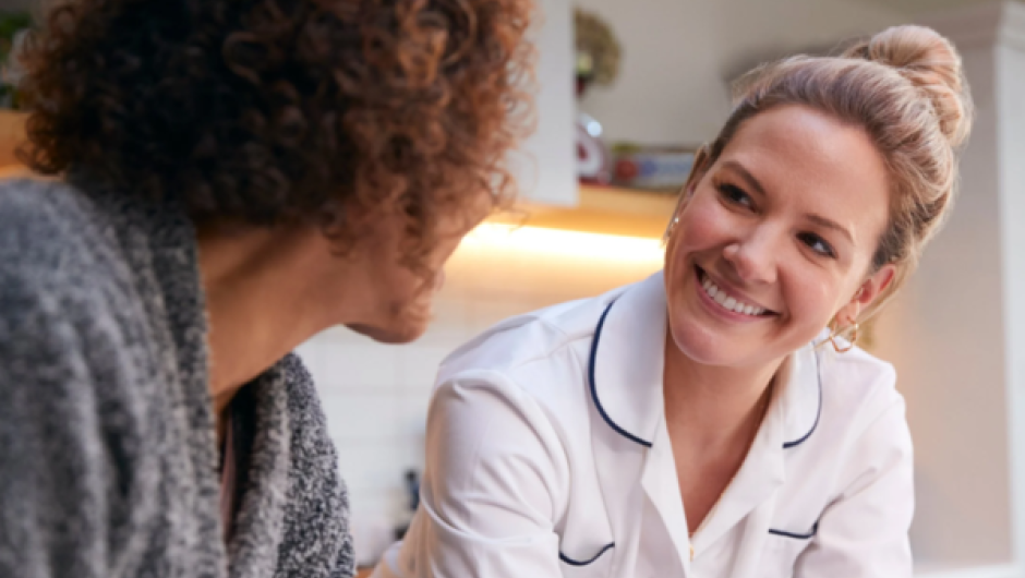 Care services worker talking to patient