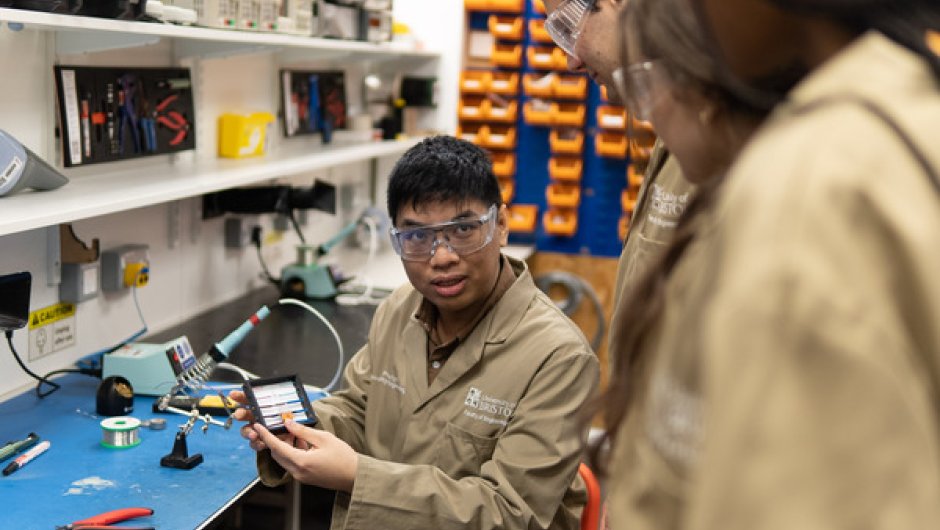 Engineering apprentices being taught in workshop 