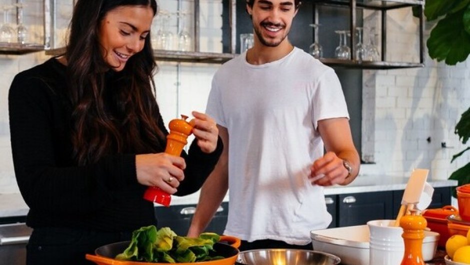 Apprentice chef in kitchen preparing food