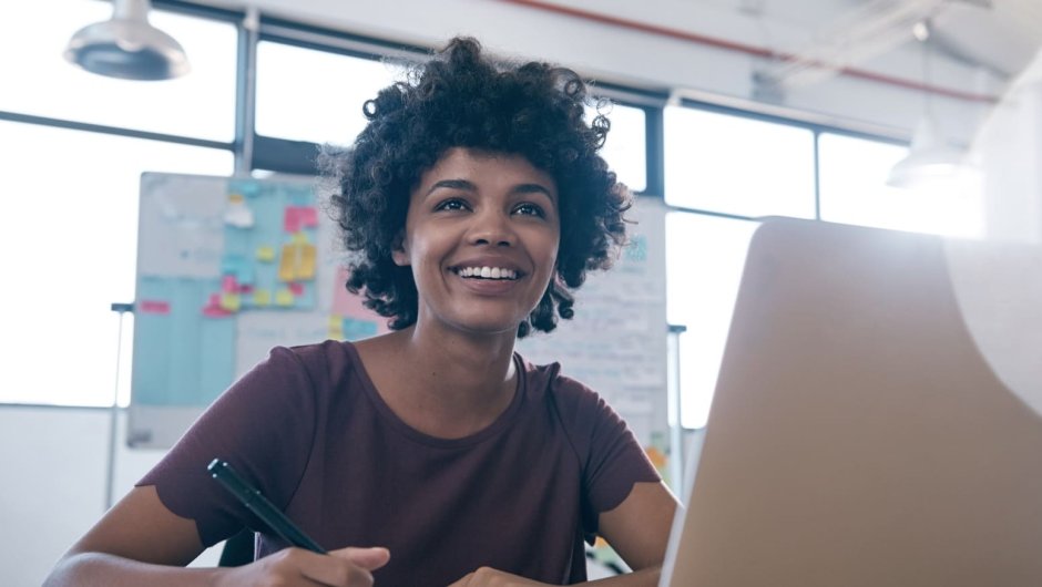 Business apprentice working on laptop