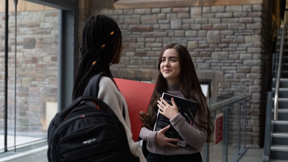 Two students chatting on campus