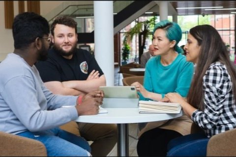 Students chatting in communal area at university