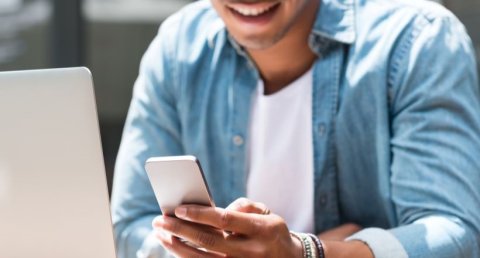 Student using laptop and mobile