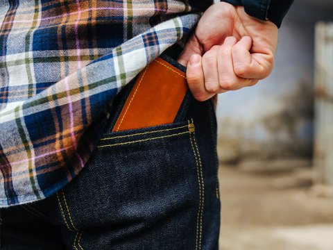 Wallet being pulled out of a back pocket