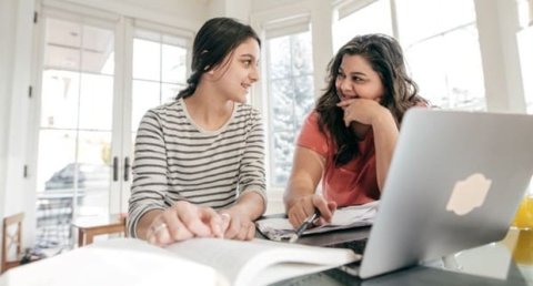 Parent and child researching options online 